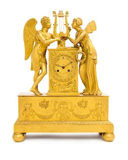 A Charles X Gilt Bronze Figural Mantel Clock Height 18 1/2 inches.