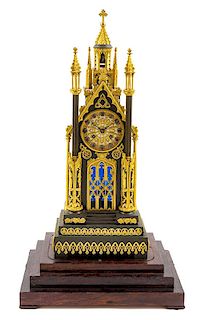 * A Louis Philippe Gilt and Patinated Bronze Mantel Clock Height 25 1/4 inches.