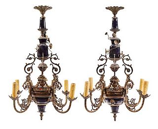 A Pair of French Gilt Bronze and Porcelain Four-Light Chandeliers Height 27 1/2 x diameter 21 1/2 inches.