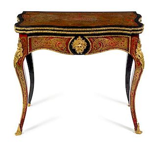 A Napoleon III Gilt Bronze Mounted Boulle Marquetry Flip-Top Table Height 30 1/2 x width 34 x depth 17 inches (closed).