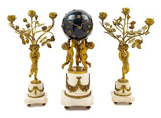 A French Gilt Bronze and Marble Globe Clock Garniture Height of clock 15 3/4 inches.