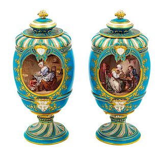 A Pair of Sevres Style Porcelain Urns Height 10 1/2 inches.