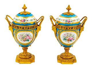 A Pair of Sevres Style Gilt Metal Mounted Porcelain Urns Height 11 1/4 inches.