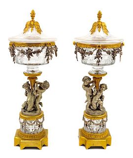 A Pair of Continental Cut Glass, Gilt and Silvered Bronze Covered Urns Height 29 inches.