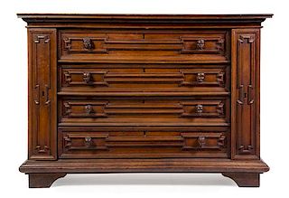An Italian Walnut Chest of Drawers Height 45 x width 64 1/2 x depth 23 1/4 inches.