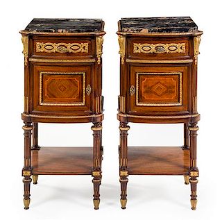 A Pair of Italian Parcel Gilt Bedside Cabinets Height 35 1/2 x width 17 x depth 14 1/4 inches.