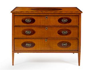 A Continental Satinwood and Mahogany Commode Height 39 x width 50 x depth 22 inches.