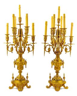 A Pair of Continental Gilt Bronze Seven-Light Candelabra Height 27 inches.