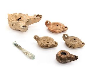 A Collection of Roman Terracotta Oil Lamps Length of longest 7 inches.