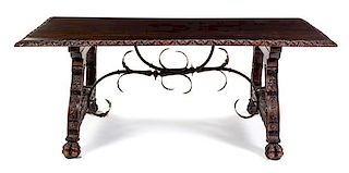 A Spanish Carved Walnut Trestle Table Height 32 1/4 x width 82 1/4 x depth 44 inches.