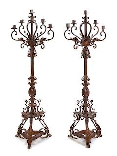 A Pair of Spanish Wrought Iron and Tole Five-Light Torcheres Height 70 inches.