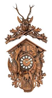* A Black Forest Carved Clock Height 27 x width 18 x depth 18 inches.