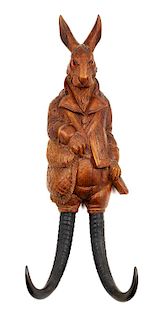 A Black Forest Carved Figural Rabbit Whip Hook Height 15 inches.