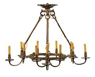 A Continental Brass Twelve-Light Chandelier Height 31 x width 38 inches.