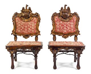 A Pair of Northern European Carved Giltwood Hall Chairs Height 47 inches.