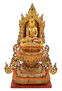 A Burmese Gilt and Red Laquered Wood Figure of Buddha Height 29 inches.