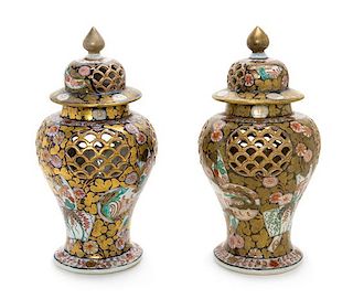 A Pair of Imari Palette Reticulated Porcelain Jars Height 14 1/4 inches.