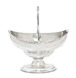 A George III Silver Sugar Basket, Peter & Ann Bateman, London, 1792, of oval form with a reeded swing handle, having a continuou