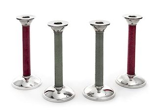 A Set of Four English Silver Candlesticks, Asprey Ltd., London, 2007, the candle cups above the leather-wrapped stem, each raise