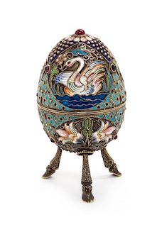A Russian Enameled Silver Egg Form Box, Mark of Nikolai Zugeryev, Moscow, First Quarter 20th Century, the lid worked to show pol