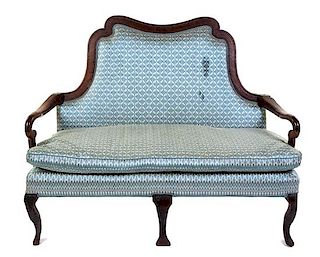 An Irish William and Mary Oak Settee Height 43 x width 54 x depth 29 inches.