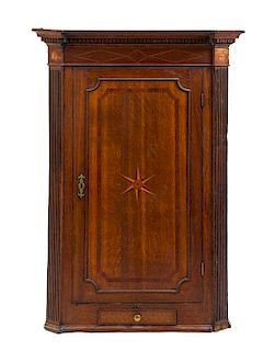 A George III Oak Hanging Corner Cabinet Height 46 5/8 x width 33 1/2 x depth 17 1/2 inches.