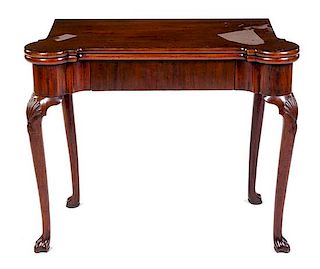 A George III Mahogany Flip-Top Game Table Height 29 x width 35 x depth 17 1/4 inches (closed).