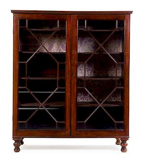 A George III Style Mahogany Cabinet Height 67 1/4 x width 57 1/2 x depth 20 inches.