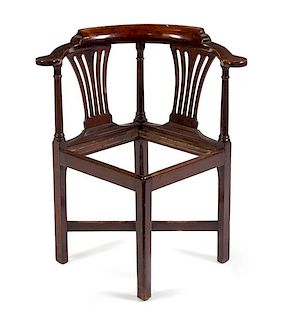 A George III Mahogany Corner Chair Height 32 3/4 inches.