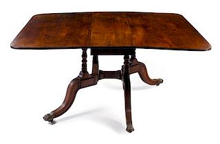 A Regency Style Drop-Leaf Dining Table Height 29 x length 59 x depth 48 inches.