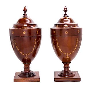 A Pair of George III Cutlery Urns Height 25 3/4 inches.