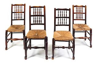 A Set of Four English Oak Lancashire Chairs Height of tallest 40 inches.