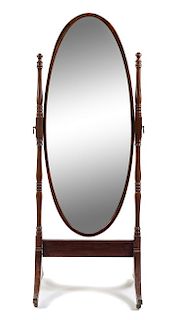 An Edwardian Mahogany Cheval Mirror Height 68 1/2 inches.