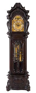 A Carved Mahogany Tall Case Clock Height 98 inches.
