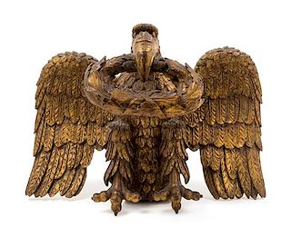 A Carved Giltwood Eagle Ornament Height 12 x width 18 1/2 inches.