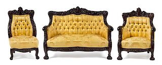 * An American Carved Three-Piece Parlor Suite Width of settee 54 inches.