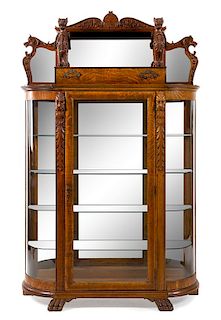 A Renaissance Revival Oak Cabinet Height 78 x width 50 x depth 15 1/2 inches.