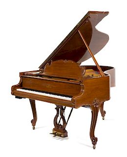 A Steinway & Sons Walnut Baby Grand Piano Height 39 x width 56 x depth 67 inches.