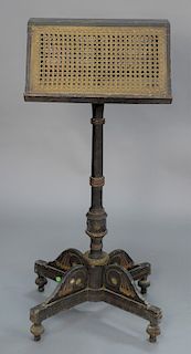 Duet music stand with caned top having original stenciling and embossed brass (top wobbly), 19th century.  height 44 in., width 19...