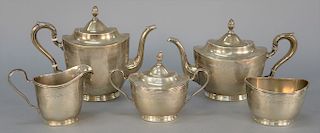 Five piece International silver tea and coffee set having tea pot, coffee pot, sugar, creamer, and waste bowl. 
height 3 1/4 in. to ...