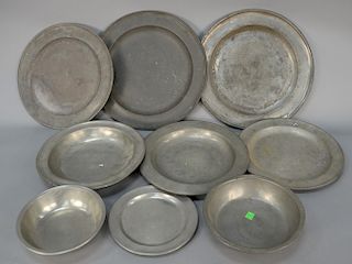 Nine piece pewter lot with chargers, two bowls, and deep plate, one plate marked Gershom, one charger marked Boston. 
diameters 8 1/...