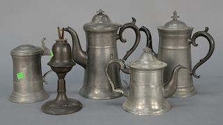 Four piece pewter lot to include three teapots, one marked R. Dun plus a whale oil lamp. 
heights 7 in. to 11 in.