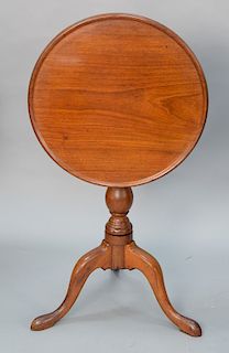 Mahogany dish top tip table on turned shaft set on tripod base. 
height 27 in., diameter 21" x 20 5/8"