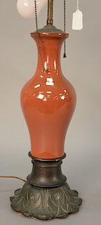 Chinese strawberry red glazed porcelain vase having slender body with sloping shoulder, rising neck and flared mount, similar to pea...