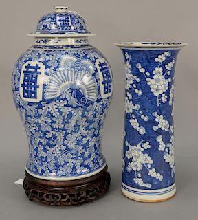 Two Chinese blue and white pieces to include a sleeve form vase with flared rim, painted with apple blossom (repaired) and a large c...