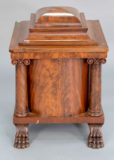 Federal mahogany cellarette with four columns and four paw feet, circa 1840. 
height 26 3/4 in., width 20 in.