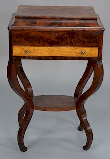 Mahogany work table with figured maple drawer front, circa 1840. 
height 31 in., width 19 in.