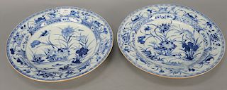 Pair of large blue and white porcelain deep chargers having painted blossoming lotus and ducks. 
diameter 14 1/4 in.