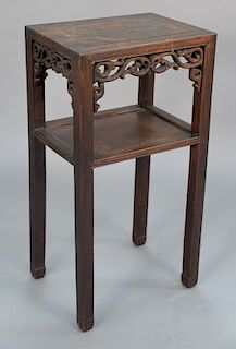 Chinese hardwood stand with pierced carved supports. 
height 31 in., top: 12" x 16 1/4" 
Provenance: Estate of Eileen Slocum located...