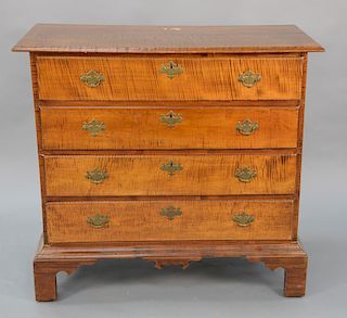 Tiger maple four drawer chest on bracket feet. 
height 38 1/4 in., case width 37 1/4 in.